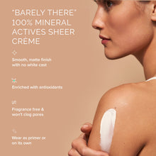 Load image into Gallery viewer, Woman applying 'Barely There' 100% mineral sheer crème on her shoulder with product details.
